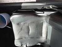 Stained black leather seat-image.jpeg