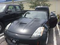 Aftermaket hood letting water into the Belts-hood.jpg
