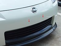 Holes in front bumper from license plate holder removal-plugs.jpg