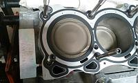 All signs of a full build again-engine-block-ceramic-coated-pistons-installed-closeup.jpg