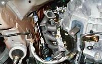 OK....I finally REALLY have pics up of my GReddy TT install process.-car-3.jpg