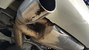 just aquired an 06 350z touring, does this look like a stock exhaust to you?-0rko9weh.jpg