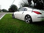 cell phone pics of my z-z-in-front-of-hood.jpg